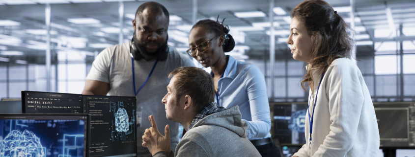 Manager doing team meeting with data center technicians, delegating tasks